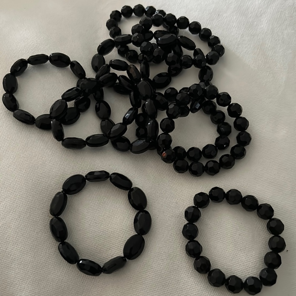11 black beaded bracelets. All in perfect condition!